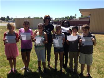 Kohler Safe School Ambassadors holding their certificates
