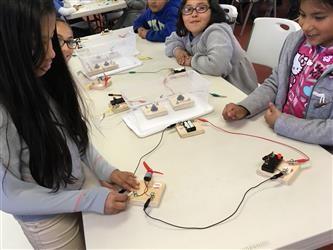 Students learning circuit boards