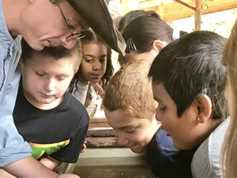 Hagginwood students panning for gold