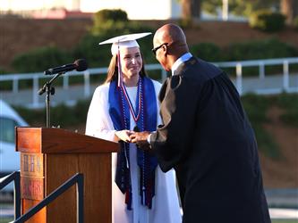 high school graduates at graduation ceremony