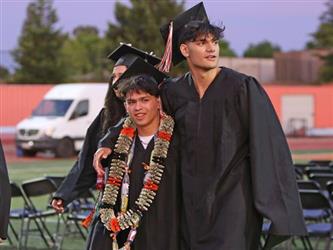 Photo of Foothill High School graduates in cap and gown.