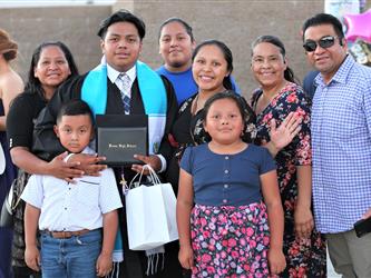 High school graduate and family
