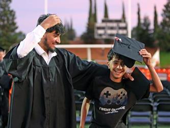 Photo of Foothill High School graduate in cap and gown.