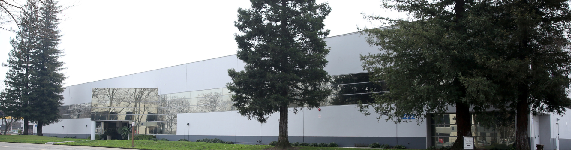 building with trees and grass