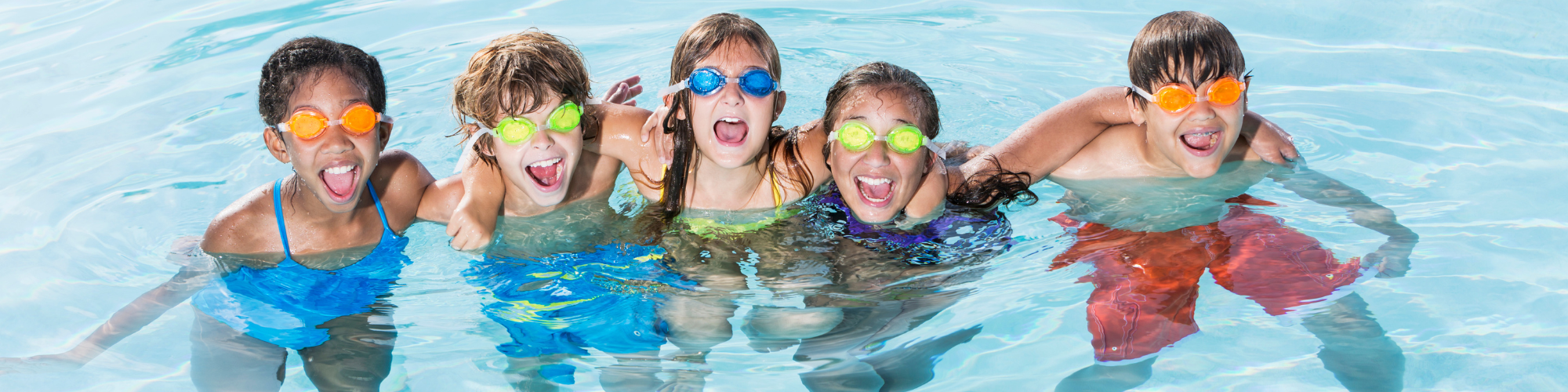kids in pool wearing swim googles